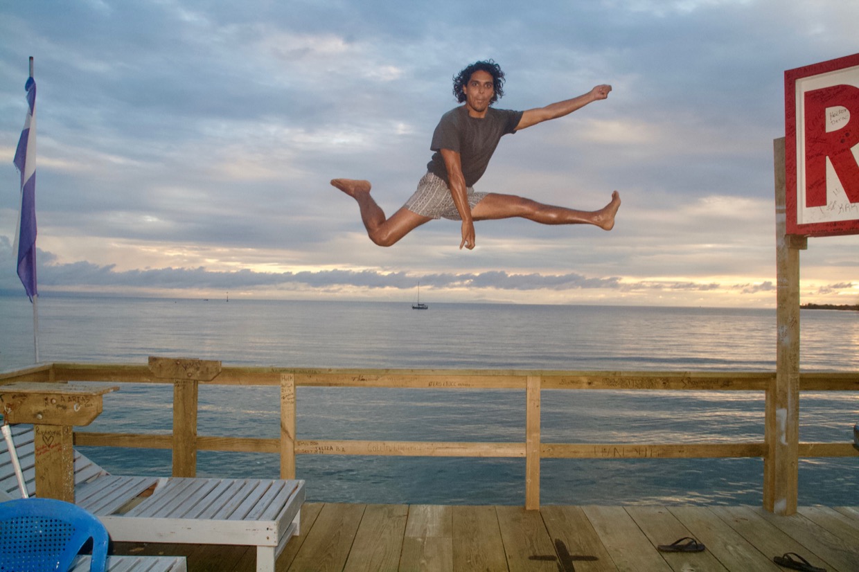 A celebratory air guitar leap from victor in utila