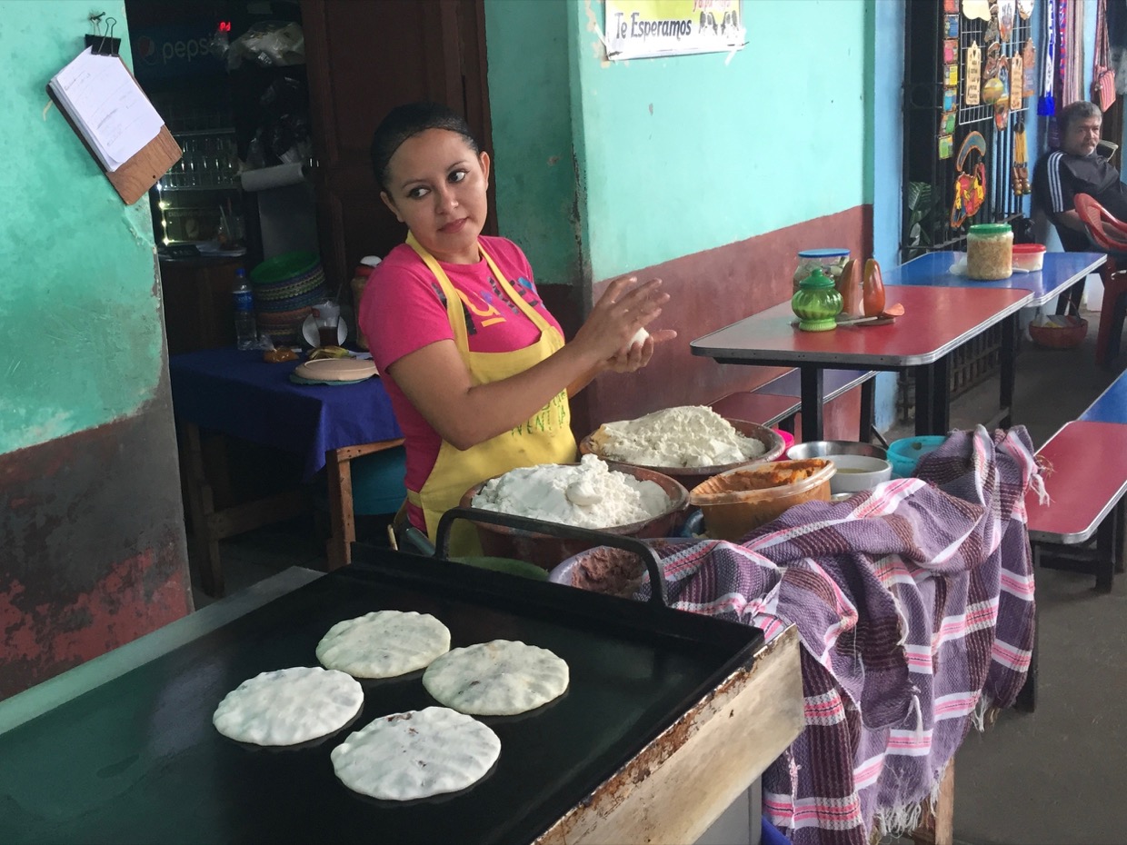 Woman making pupusas in suchitoto